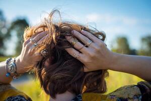 Fashion shot of a beautiful boho style girl on nature background. Boho, hippie. photo