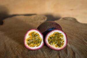 Juicy of Passion Fruit on wooden background photo
