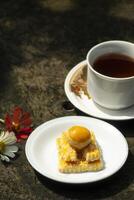 backed cake and tea with flowers photo