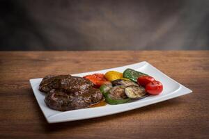 Steak on serving plate photo