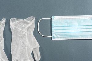 Disposable rubber medical gloves and mask. photo
