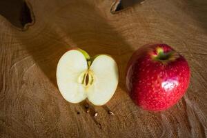 Fresh red apples on a wooden background photo