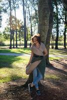 Fashion shot of a beautiful boho style girl on nature background. Boho, hippie. photo