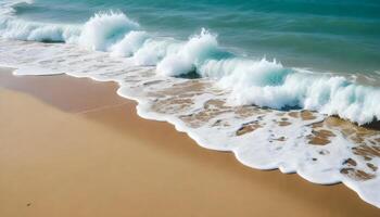 Turquoise ocean water with white foam waves crashing onto a sandy beach photo