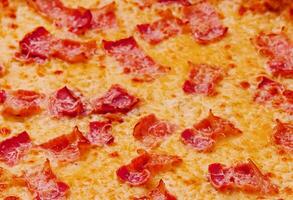 Pizza with bacon and cheese close up photo