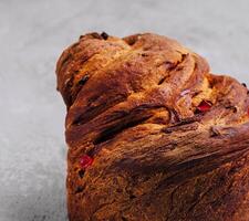 Italian dessert panettone with raisins top view photo