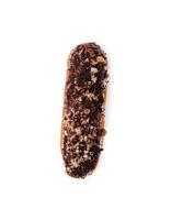 eclair with chocolate and nuts on a white photo