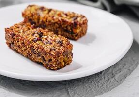 Two granola bar on plate photo