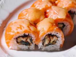 Salmon Fried sushi roll with eel and cheese photo