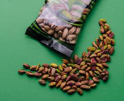 pistachios peeled and unpeeled and packaging photo