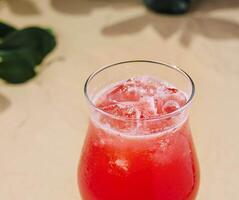 Cold summer strawberry cocktail with lime photo