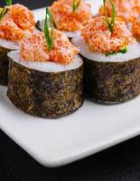 Sushi roll with salmon and caviar photo