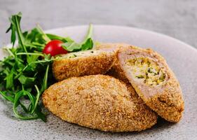 Meat cutlets with boiled egg photo