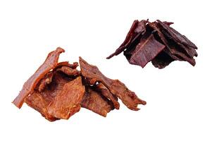 Dried beef and pork jerky isolated on white background photo