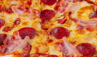 Pepperoni Pizza with Mozzarella cheese, salami, ham photo