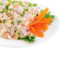 Olivier salad, isolated on white background photo