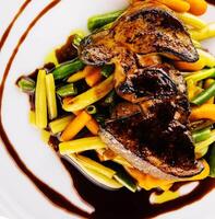 liver dish with green beans and carrots photo