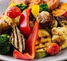 Various barbecue grilled vegetables on plate photo