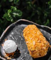 Puff pastry log cake with a scoop of ice cream photo