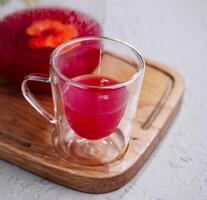 Raspberry Tea in Pitcher and Glass photo