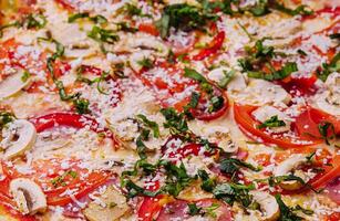 Delicious freshly baked pizzas close up photo