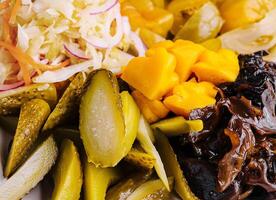 Marinated salty vegetables close up photo