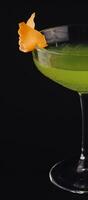 Apple martini coctail isolated on black background photo