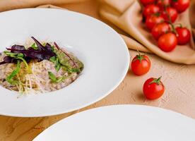 rice with parmesan on white plate photo