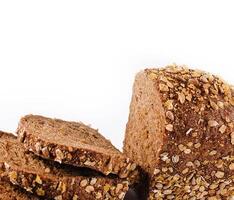 Loaf of whole wheat bread isolated on white photo