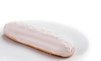 One delicious eclair covered with glaze photo