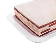 Delicious multilayer cocoa sponge cake with sugar mass photo