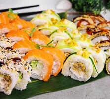 Different types of Japanese sushi on plate photo