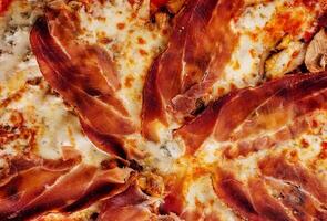 Pizza with jamon, cheese and mushrooms close up photo