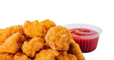 Chicken nuggets with sauce isolated on white photo