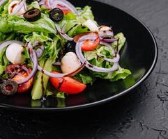 Salad with cherry tomatoes and mozzarella photo