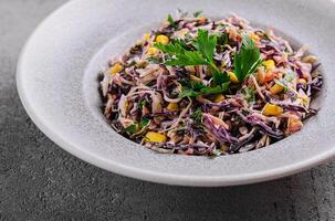 Fresh red cabbage salad with corn photo