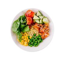 Fresh salmon poke bowl on white background photo