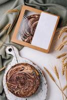 top view of tasty homemade cake on wooden cutting board photo