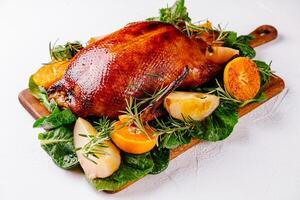 Succulent roast duck with citrus and herbs photo