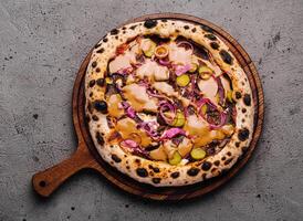 Gourmet vegan pizza on rustic table photo