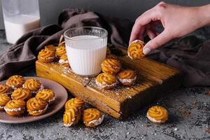 Homemade viennese whirls with fresh milk photo