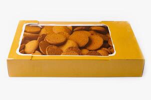 Box of crispy ginger cookies isolated on white photo