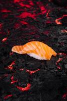 Sushi on lava texture background photo