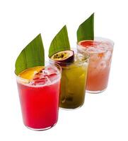 Trio of tropical cocktails with exotic garnishes photo