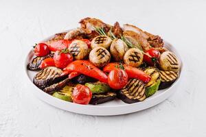 Grilled vegetables and chicken plate photo