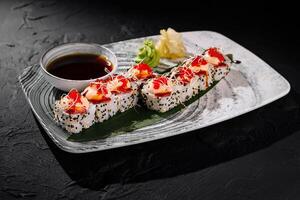 Gourmet california sushi roll with soy sauce photo