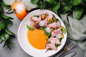 Fresh spinach and roast beef salad with orange dressing photo