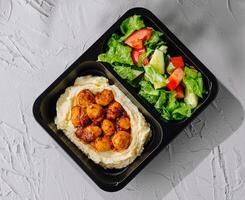 Healthy shrimp meal prep on white background photo