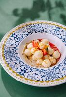 Elegant fruit salad in decorative bowl photo