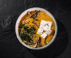 Homemade miso soup with tofu and seaweed photo